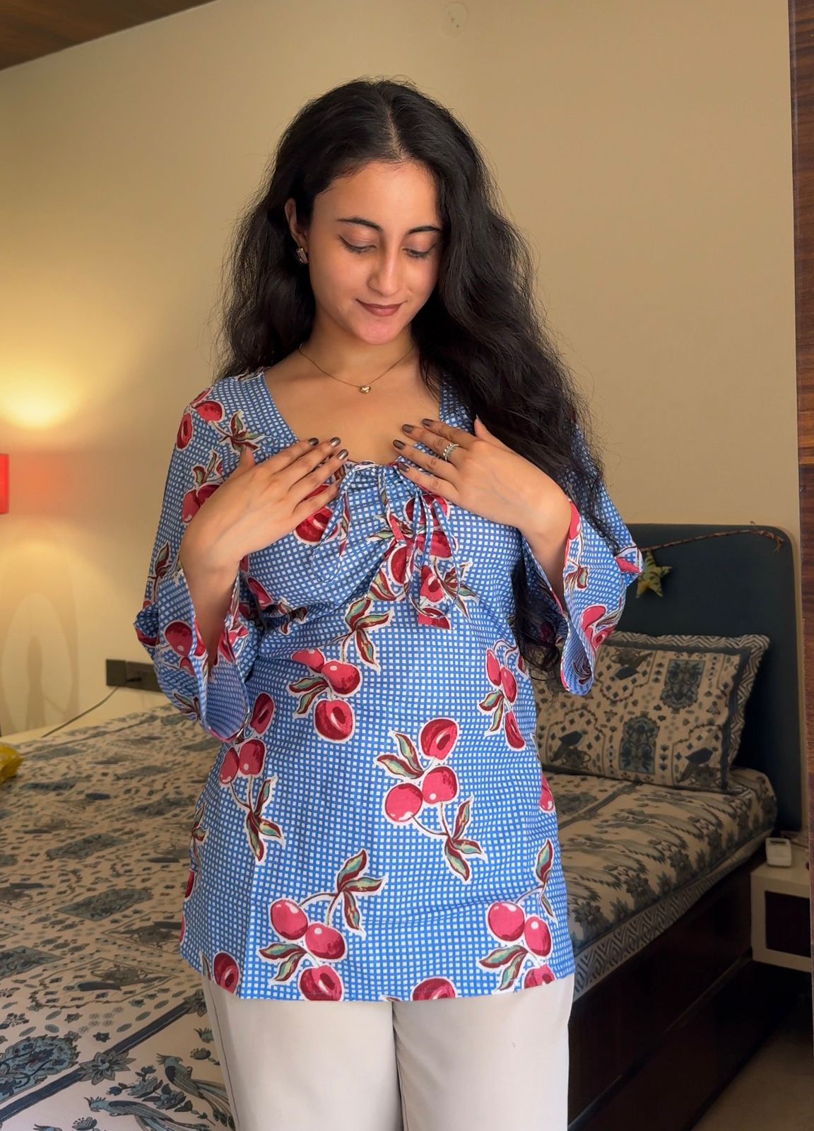 A woman wearing a floral cotton kurti