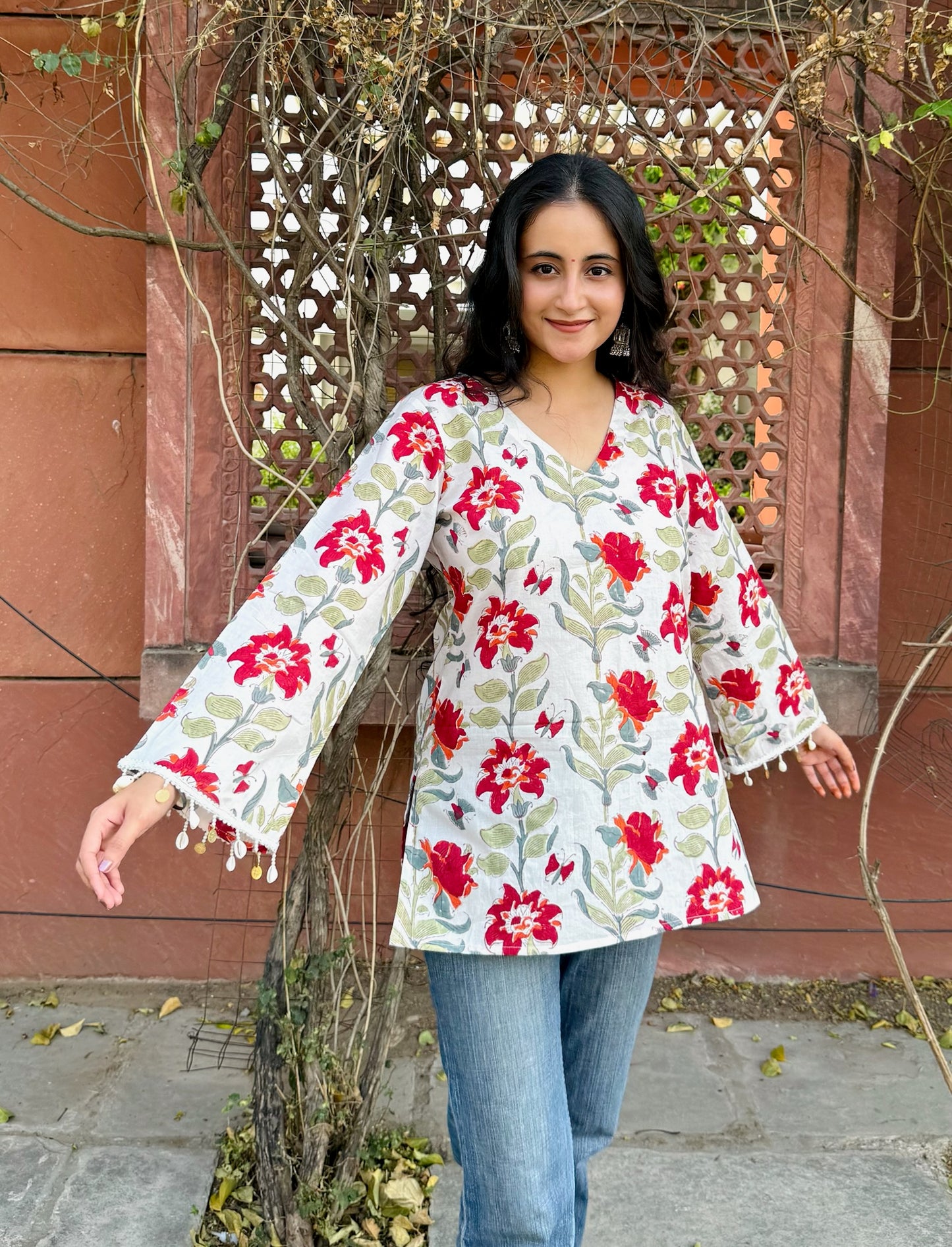 A woman wearing a blue floral cotton kurti