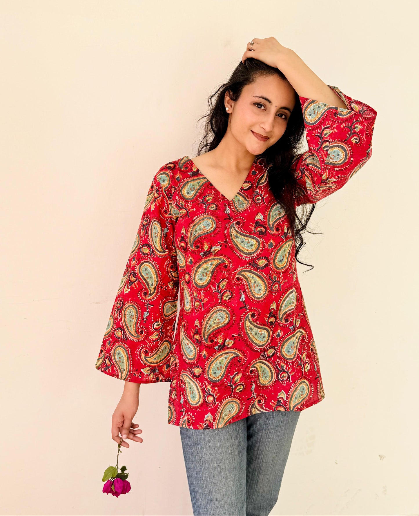 A woman wearing a blue floral cotton kurti