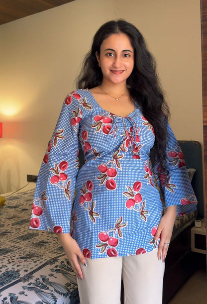  A woman wearing a  floral cotton kurti