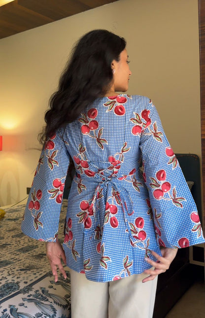 A woman wearing a  floral cotton kurti