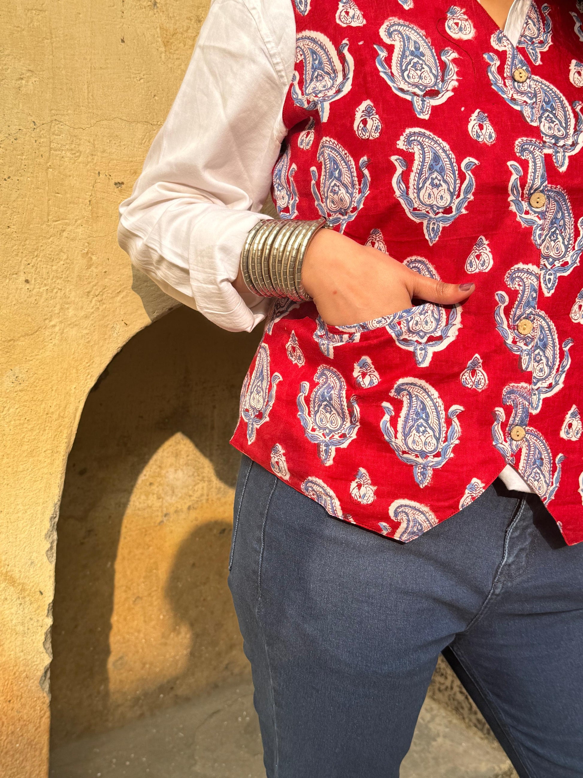 A woman wearing a blue floral cotton Vest Top