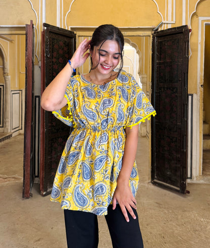 A woman wearing a blue floral cotton Comfy Top