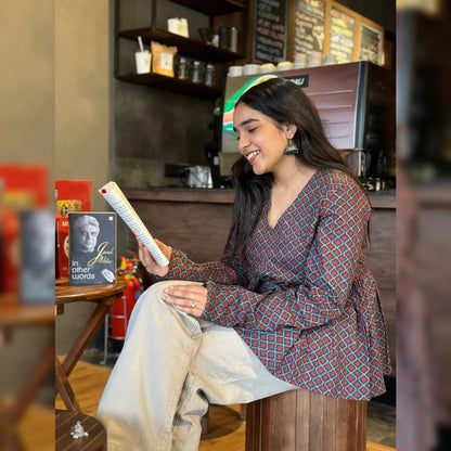 A woman wearing a floral cotton top
