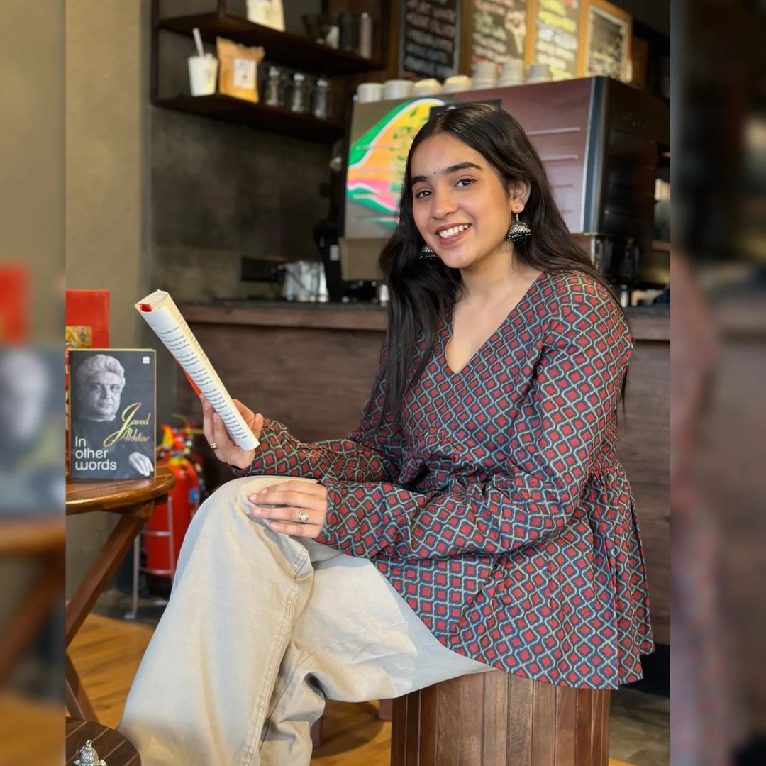 A woman wearing a  floral cotton top