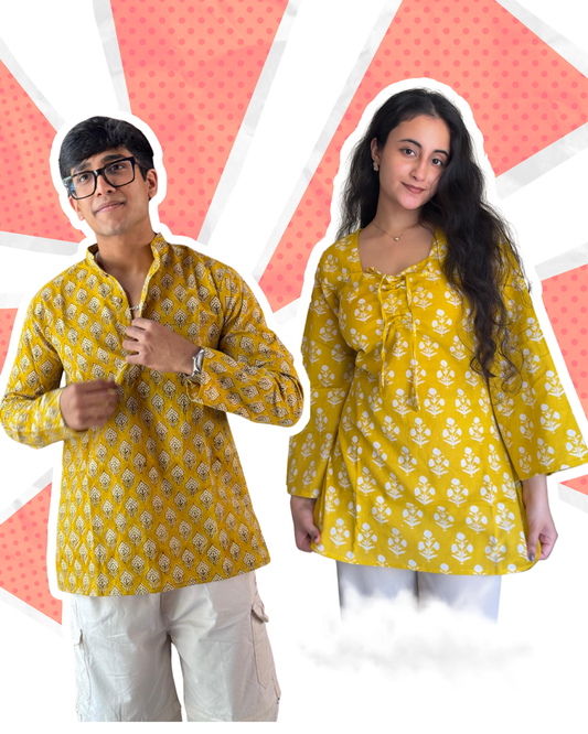 Two people wearing yellow patterned shirts on a colorful background