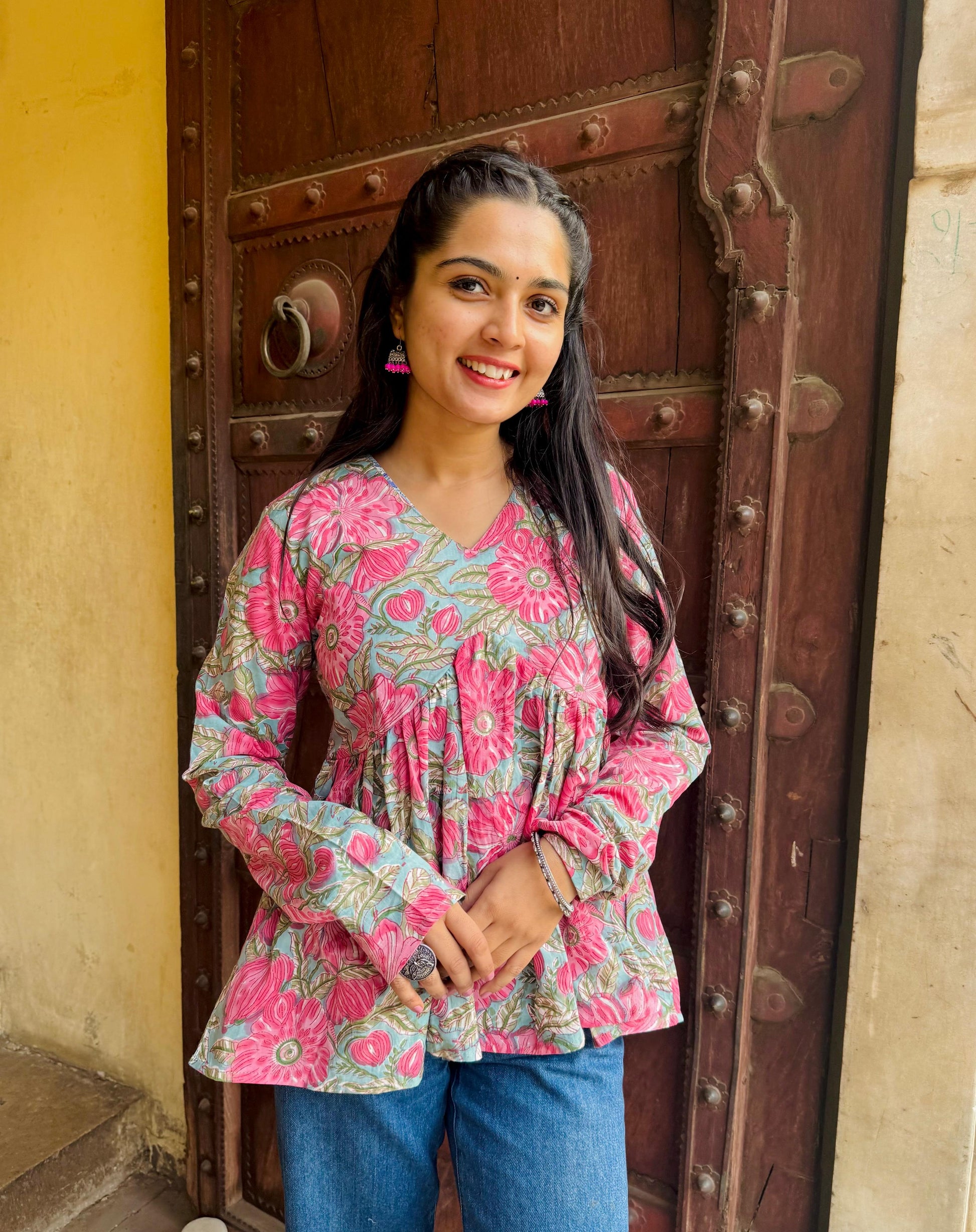  A woman wearing a blue floral cotton kurti