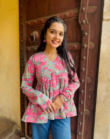  A woman wearing a blue floral cotton kurti