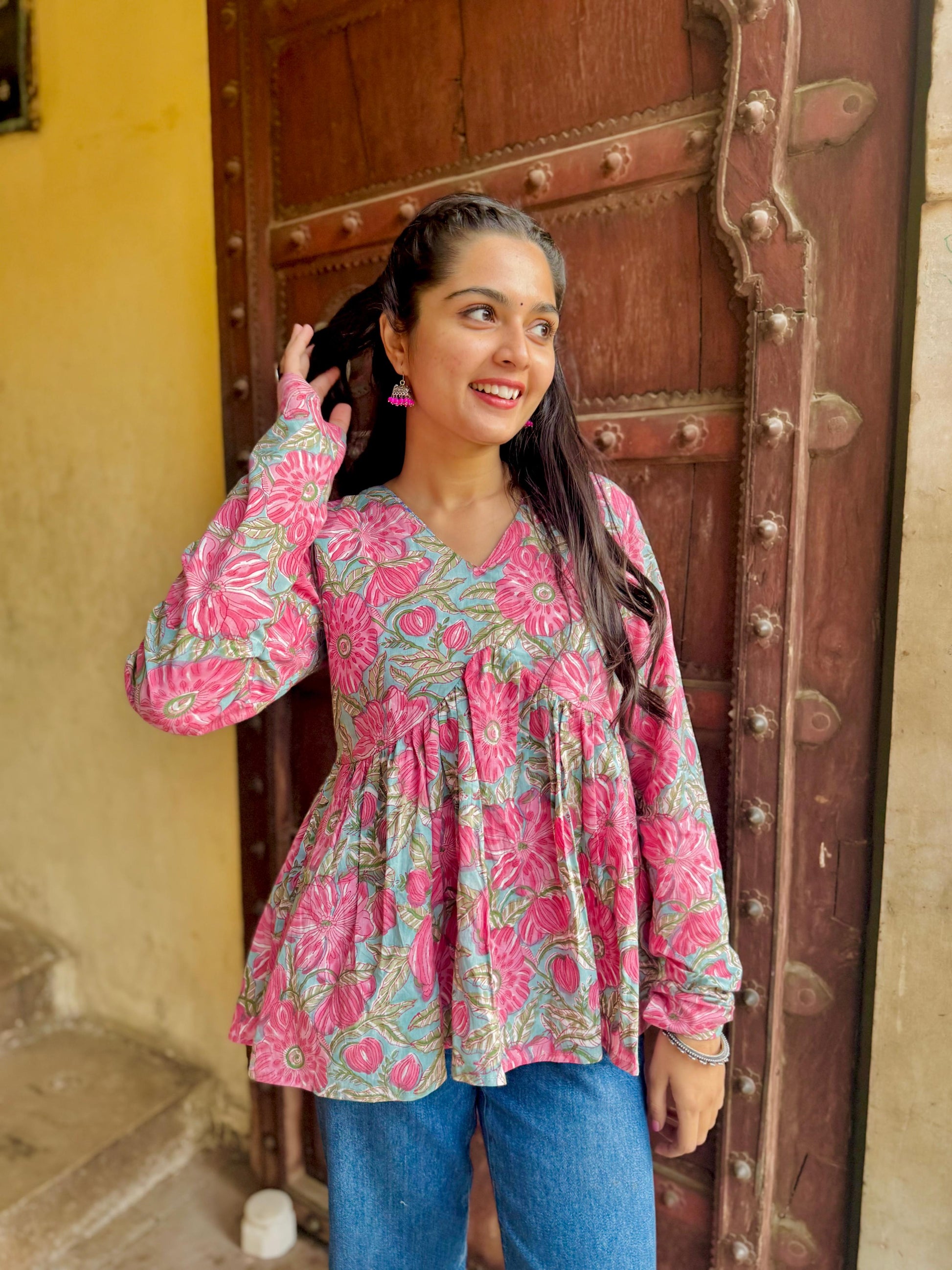  A woman wearing a blue floral cotton kurti