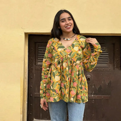 A woman wearing a blue floral cotton kurti