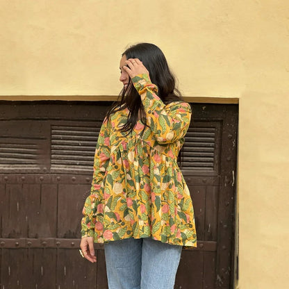 A woman wearing a blue floral cotton kurti