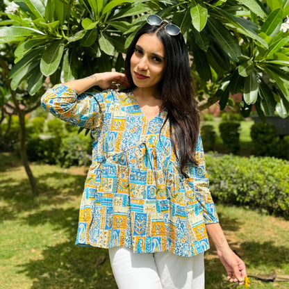 A woman wearing a printed floral cotton top