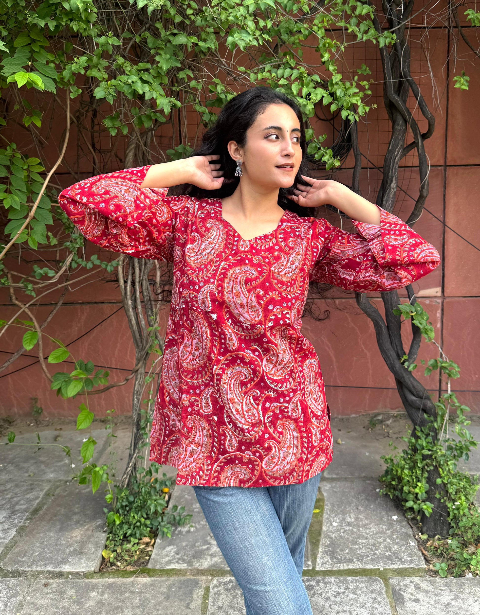 A woman wearing a blue floral cotton kurti