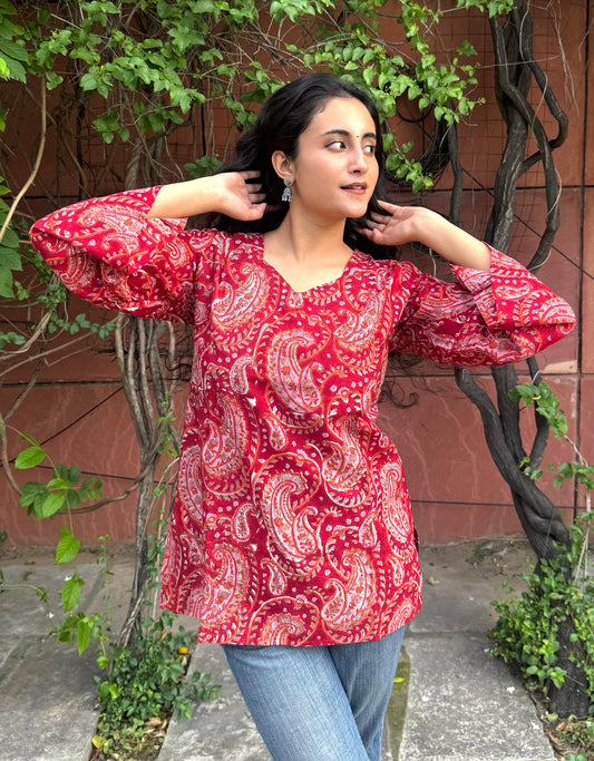A woman wearing a blue floral cotton kurti