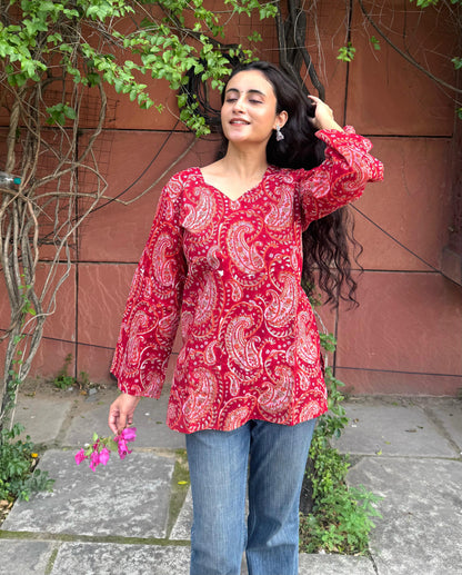 A woman wearing a blue floral cotton kurti
