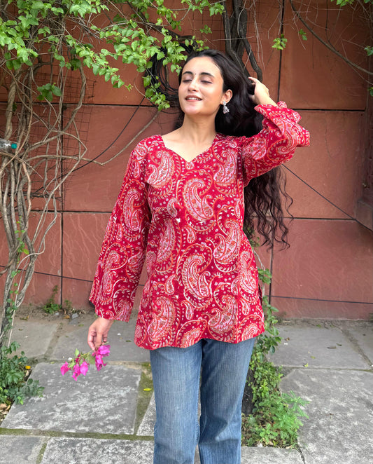 A woman wearing a blue floral cotton kurti