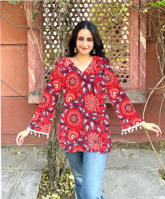 A woman wearing a blue floral cotton kurti