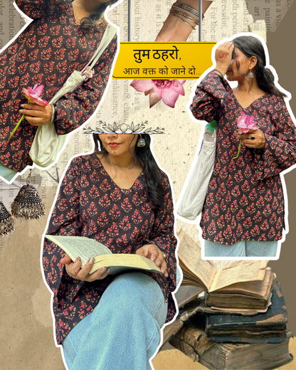 A woman wearing a blue floral cotton kurti