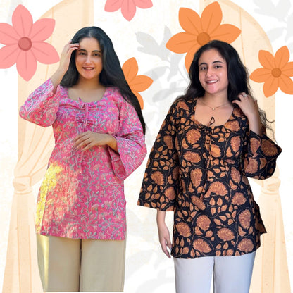 Two women wearing patterned tops with a floral background