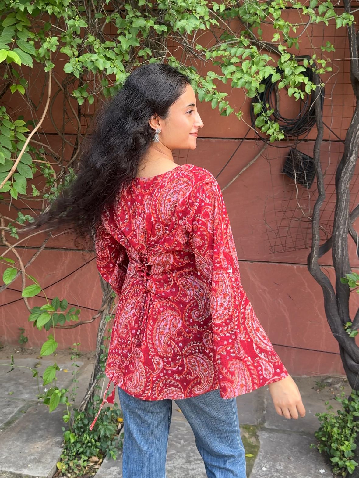 A woman wearing a blue floral cotton kurti