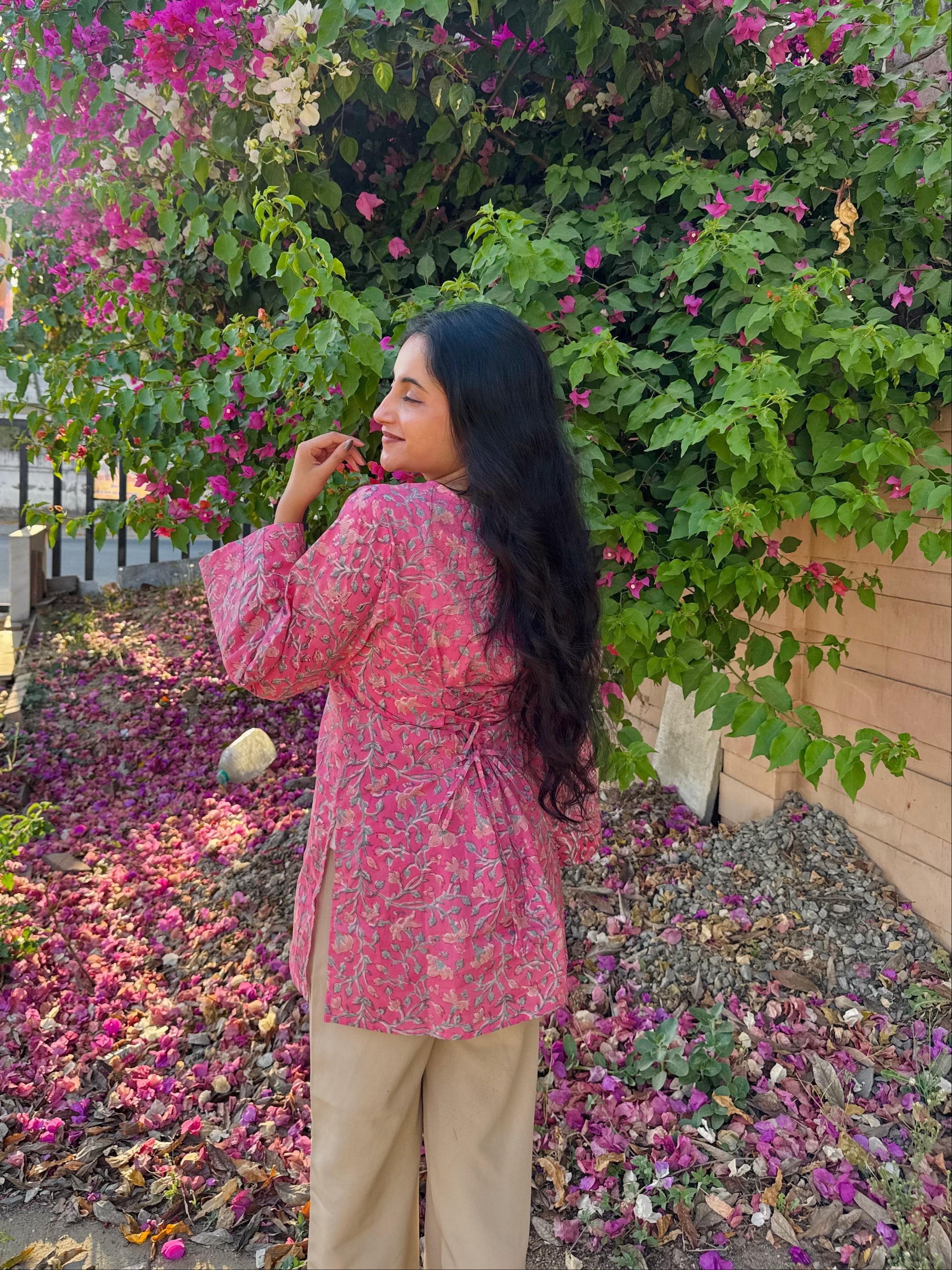  A woman wearing a  floral cotton kurti