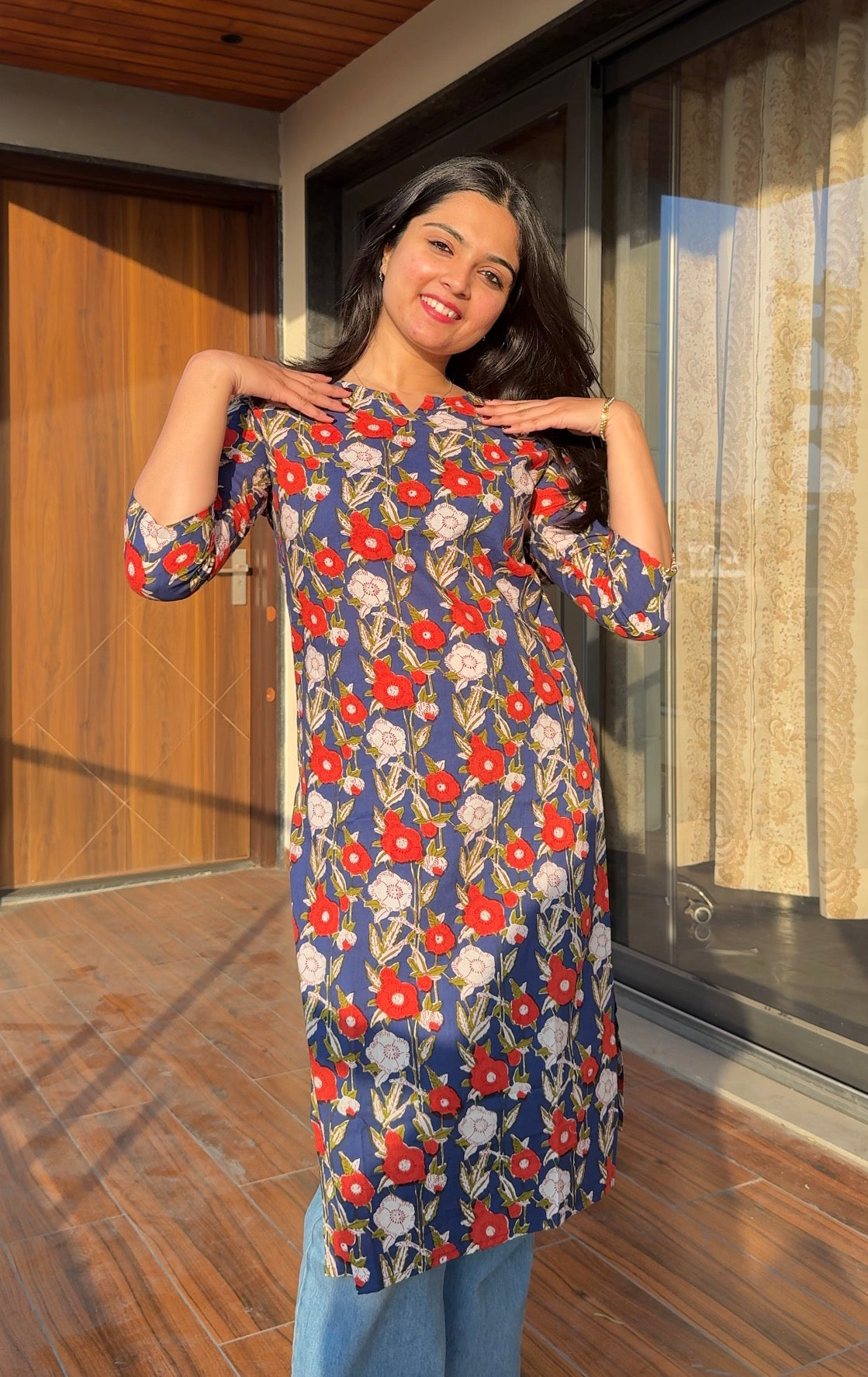  A woman wearing a  floral cotton kurti