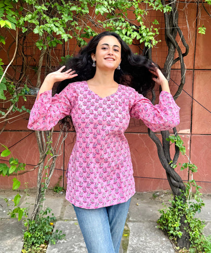 A woman wearing a blue floral cotton kurti