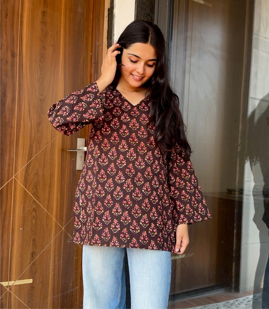 A woman wearing a blue floral cotton kurti
