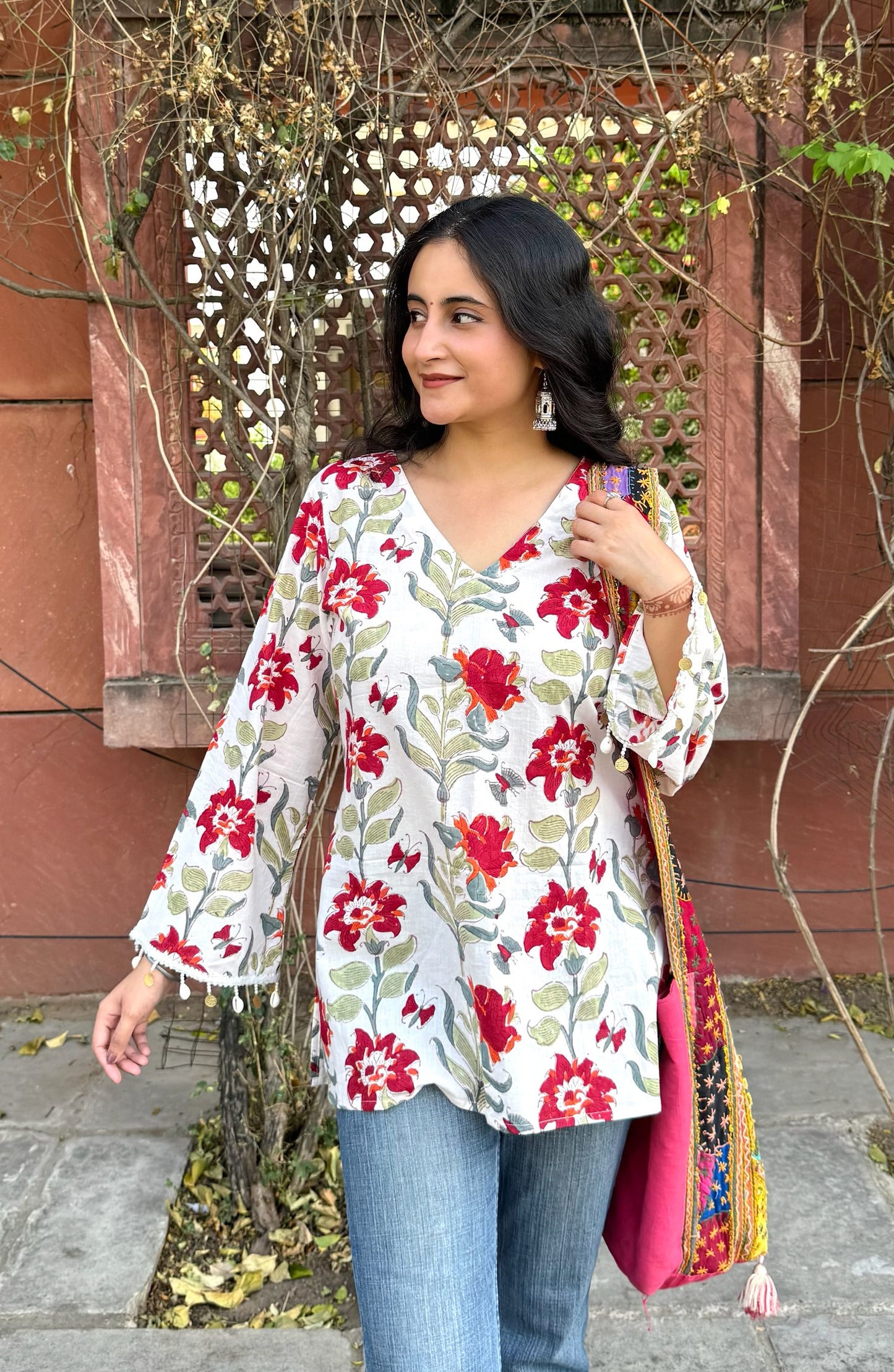 A woman wearing a blue floral cotton kurti