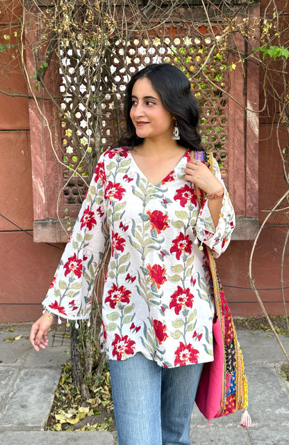 A woman wearing a blue floral cotton kurti