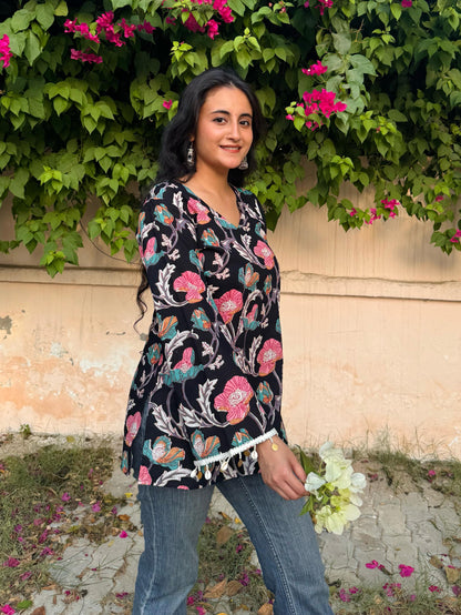 A woman wearing a blue floral cotton kurti