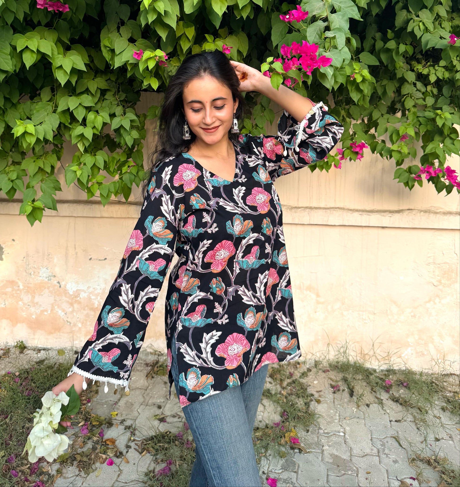 A woman wearing a blue floral cotton kurti