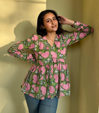 A woman wearing a blue floral cotton kurti