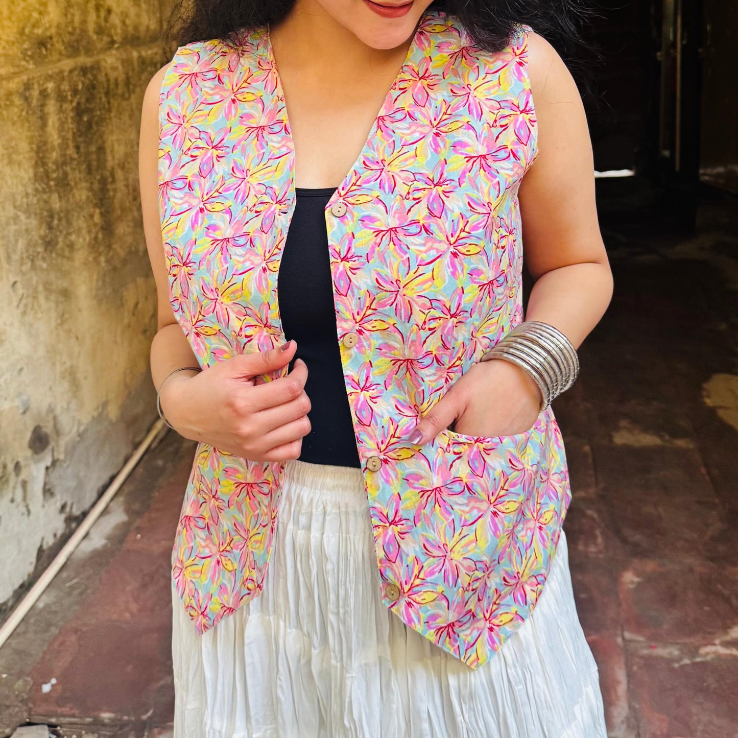 A woman wearing a blue floral cotton Vest Top