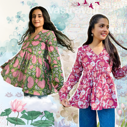 Two girls wearing floral clothing; one in a green and pink floral dress and the other in a pink floral tunic over a white top, standing against a backdrop with floral elements.