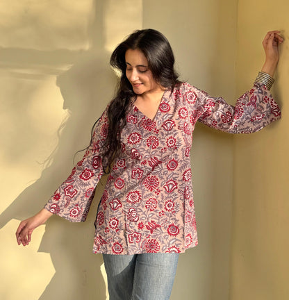A woman wearing a floral cotton kurti