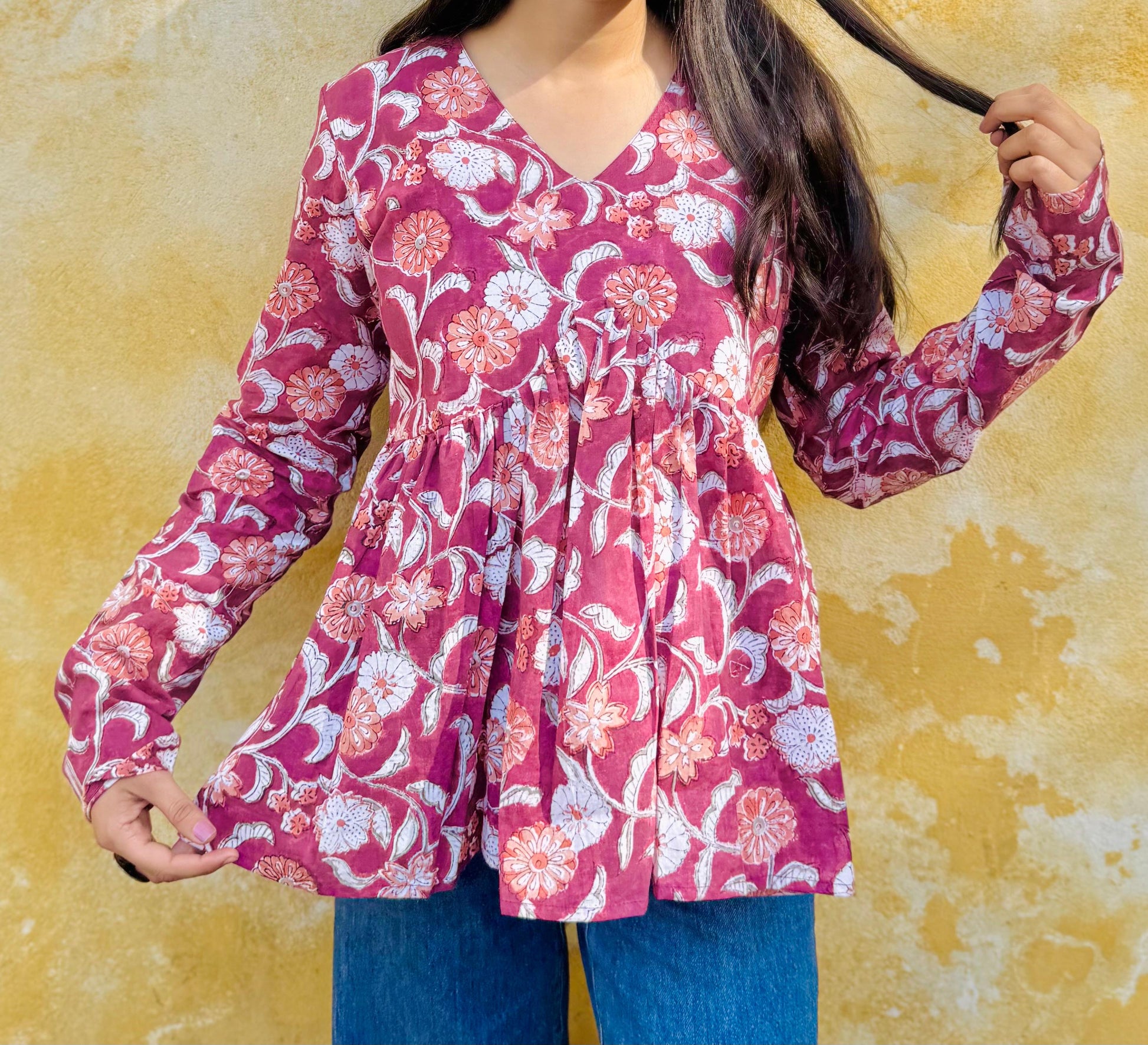 A woman wearing a floral cotton  top