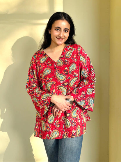 A woman wearing a blue floral cotton kurti