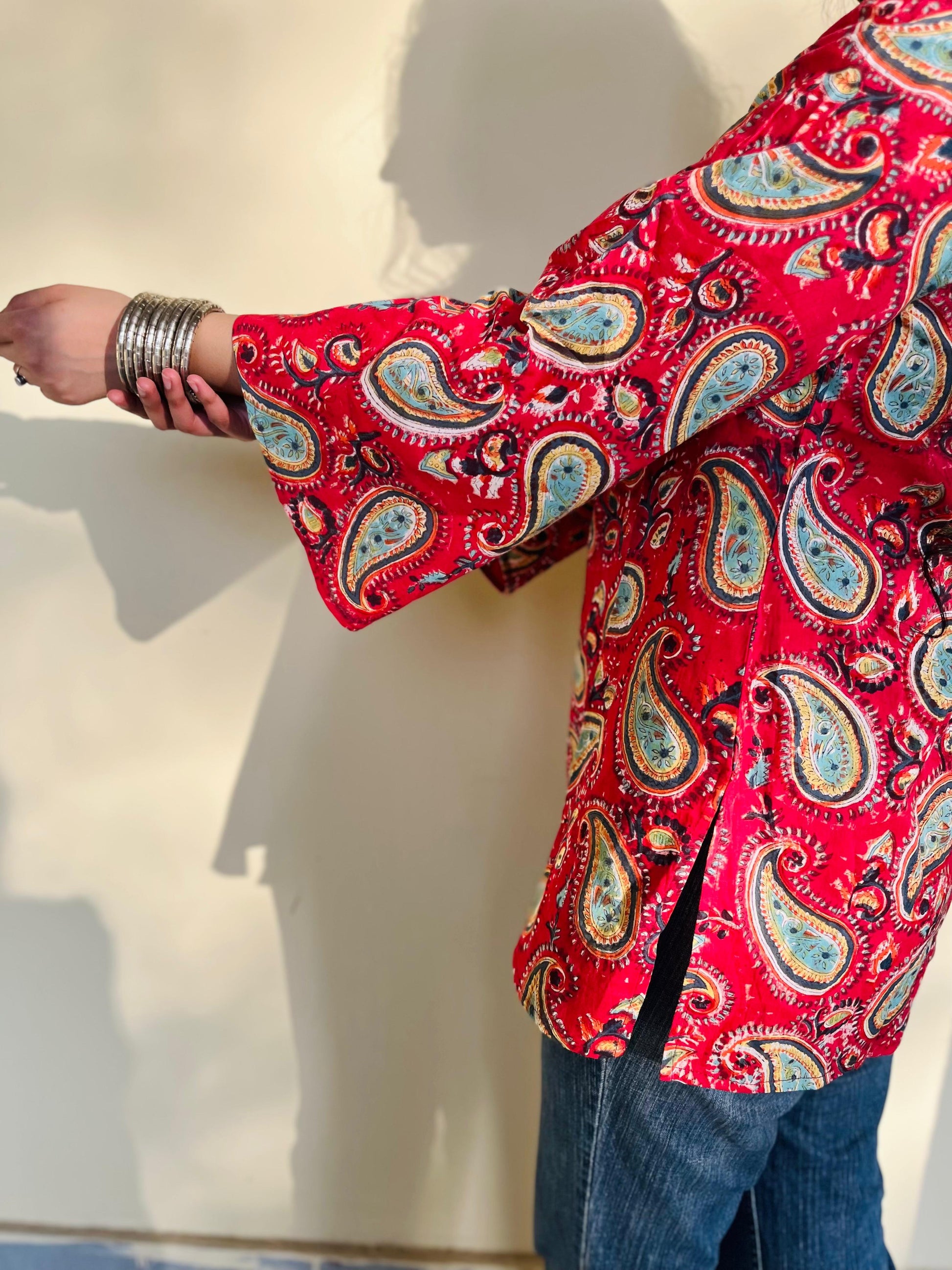 A woman wearing a blue floral cotton kurti